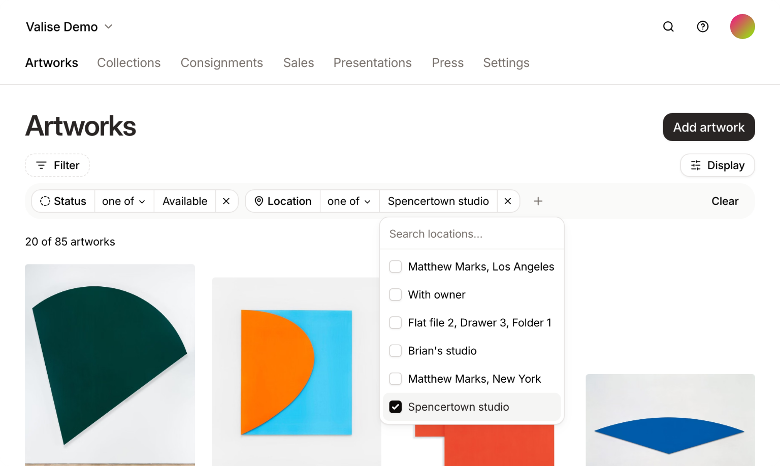 The Artworks page with two filters applied, Status is one of Available and Location is one of Spencertown studio, narrowing the grid to 20 of 85 artworks. The location picker is open with Spencertown studio checked.