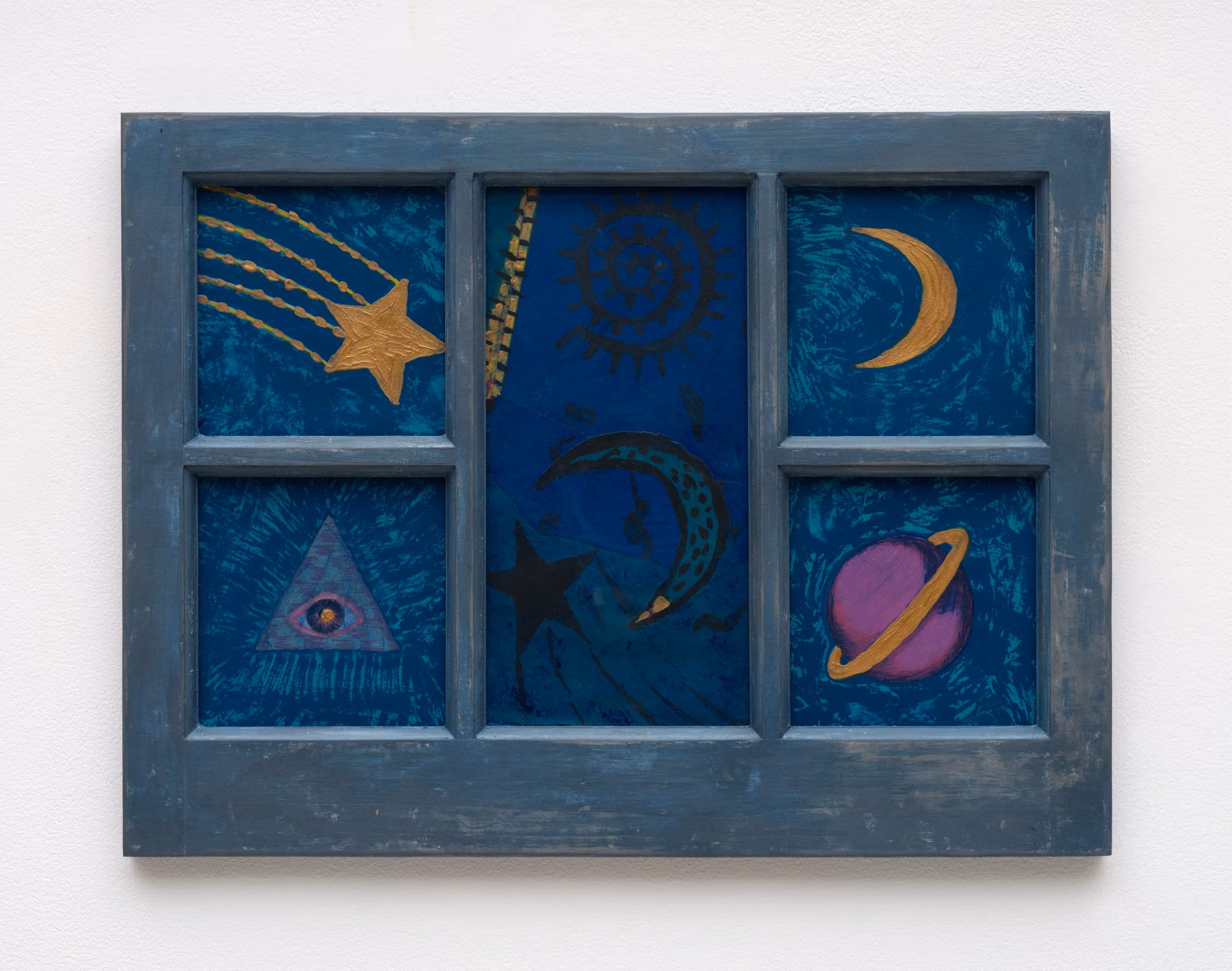 A blue-painted wooden window frame with six panes, each containing cosmic-themed illustrations.